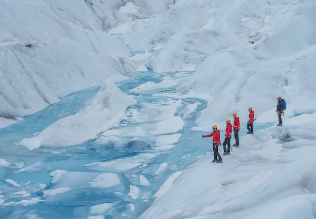 trekkers on a glacier