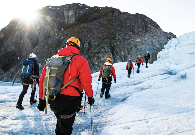 trekkers on a glacier
