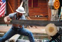 Photo of Lumberjack with big saw