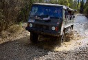 Photo of Off Road Vehicle Front View Going Through Puddle