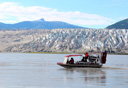 Photo of airboat in front od glacier