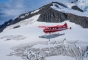 Photo of floatplane over a glacier