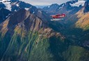 Photo of floatplane over mountains