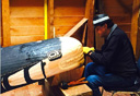 Photo of man carving totem
