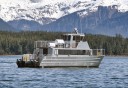 Photo of newest juneau whale watching boat with mountains in background