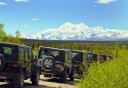 Photo of traveling jeeps with scenic views