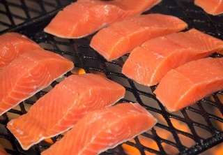 Photo of Fresh salmon grilling over an open fire