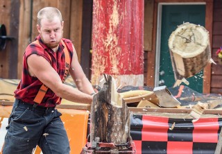 Photo of Lumberjack swinging axe
