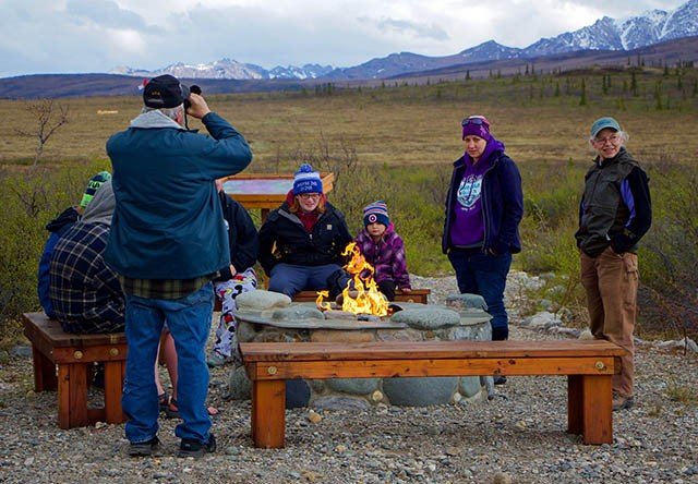 Photo of Guests Sitting Around Firepit