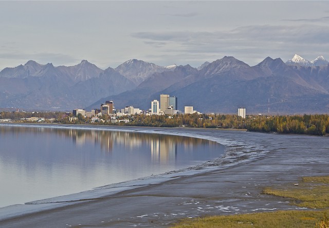 Photo of anchorage from a distance with mtn ranges