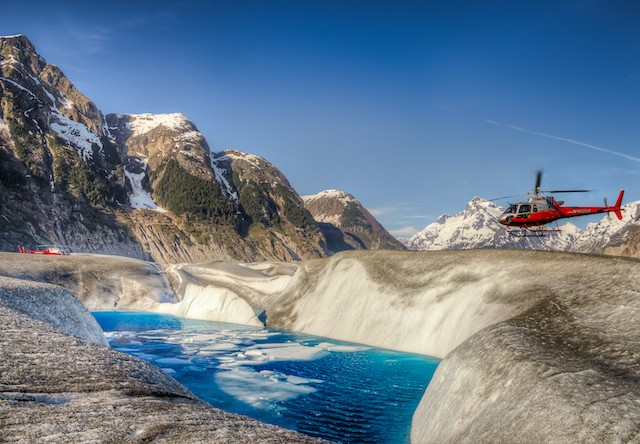 Photo of helicopters on a glacier
