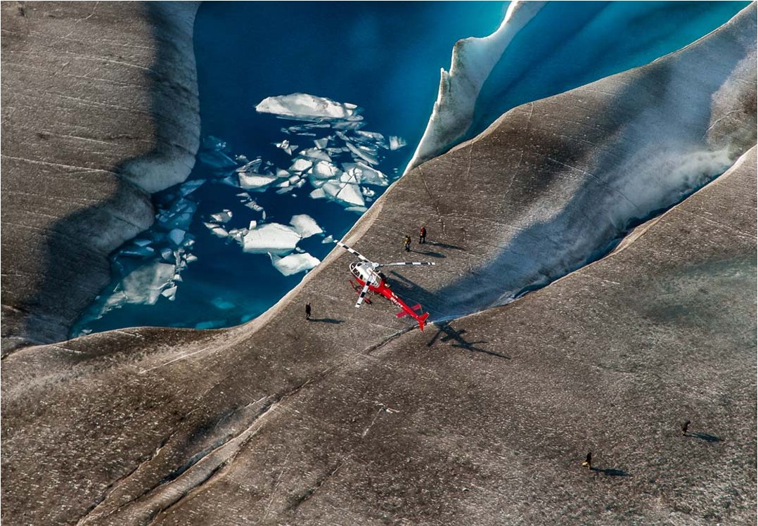 helicopter landing on glacier